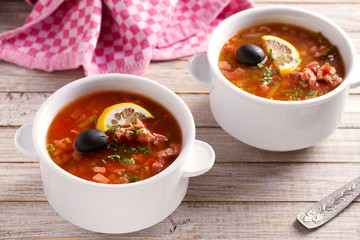 Traditional Russian dish  solyanka - thick, spicy and sour saltwort soup