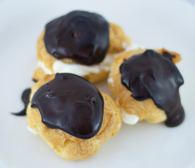 Profiterols isolated on white background
