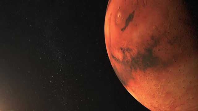 Planet Mars. View from space. Mars rotates slowly. The planet is illuminated by the sun. Stars twinkle. 4K. Planet on the right in the frame.