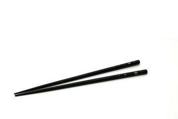 Black Japanese hashi chopsticks. Asian eating utensils.Isolated on white background.