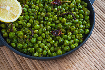 Green peas with chili pepper. Indian dish.
