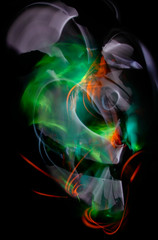The abstract image painted by moving light and moving objects. Improvisational movements by light. Light in motion. Color abstraction.