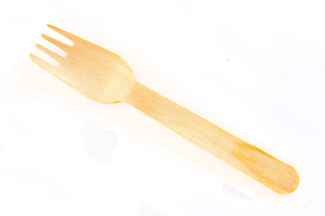 Wooden fork on white background