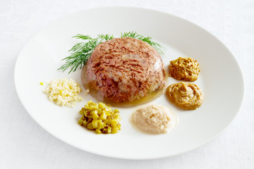 holodets with relishes - pickled cucumber, russian and french mustard, garlic, and horseradish...