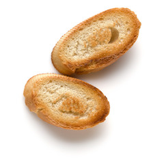 Toasted baguette slices isolated on white background close up.  Toast, crouton.   Top view.