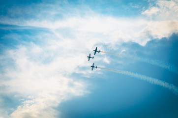 Three airplanes in blue sky