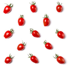 Food pattern of cherry tomato isolated on yellow background. Flat lay, top view.