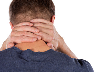 Fototapeta premium Man holding his neck in pain on white background. Lower neck pain. Guy touching his neck for the pain