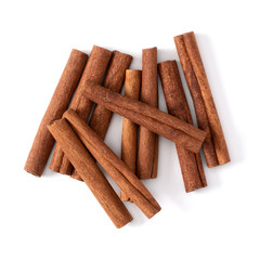 Cinnamon sticks isolated on white background closeup. Canella spice. Aromatic condiment background. Flat lay, top view.