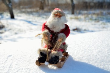 Christmas toys Santa Claus in a sleigh, in the woods, outdoors.