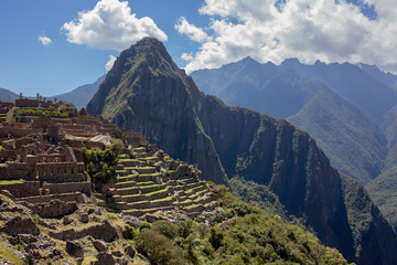 Machu Picchu, The Incan ruins, Top view, sunny day, clouds, UNESCO World Heritage Site, One of the New Seven Wonders of the World, Peru