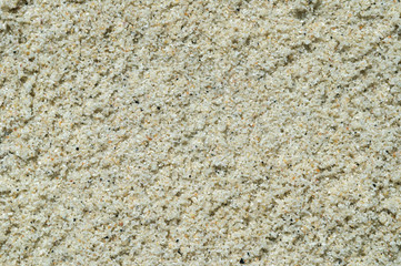 The texture of natural sand on the beach.
