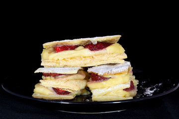 French Mille-feuille cake with fresh strawberry with isolated black background