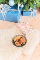 Christmas cookies on the carpet in the living room at the Christmas tree