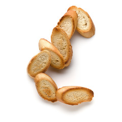 Toasted baguette slices isolated on white background close up.  Toast, crouton.   Top view.