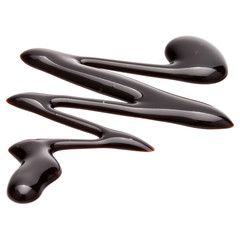 Obraz premium Chocolate syrup drop isolated on white background