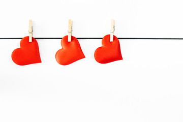 Hearts hanged on a white background. Valentines Day concept.