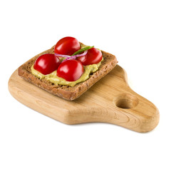 Open  faced vegetable sandwich canape or crostini on a wooden serving board  isolated on white background closeup. Vegetarian tartarine.