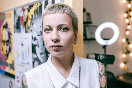 Appealing Female With Green Big Eyes Having Unusual Boyish Haircut