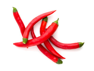 Chili peppers on a white background. A few fresh red peppers on a white background.