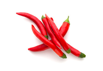 Chili peppers on a white background. A few fresh red peppers on a white background.