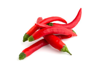 Chili peppers on a white background. A few fresh red peppers on a white background.