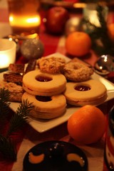 Christmas still-life with candle-light atmosphere and homemade cookies (high light)