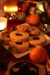 Christmas still-life with candle-light atmosphere and homemade cookies (low light)