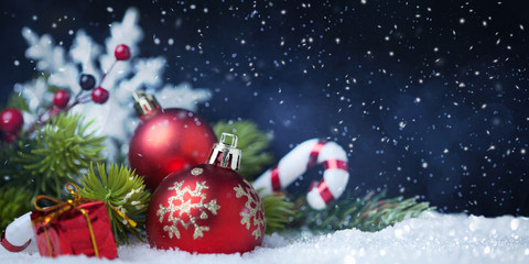 Fototapeta na wymiar Christmas balls with tree and decorations on snow