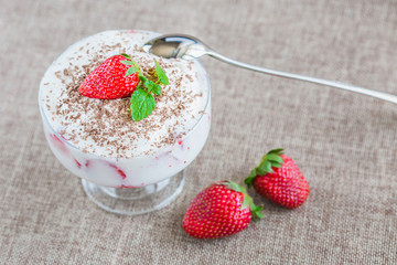 Ice cream with strawberry in glass. Summer and sweet menu concept.