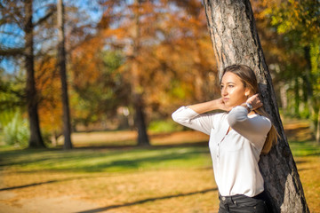 Photographing a girl during autumn with a blurred background