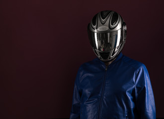 studio portrait of a biker on a black background