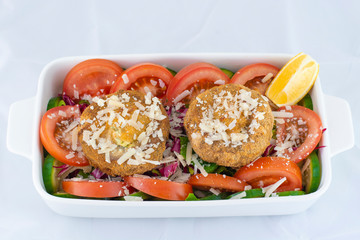Deep fried mushroom salad with fresh mushroom, cheese and fresh vegetables with isolated black background