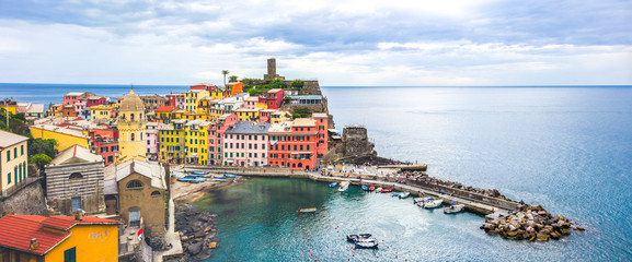 beach streets and colorful houses on the hill in Vernazza in Cinque Terre in Italy 
