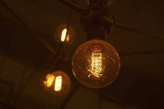 light bulb closeup burning in the dark