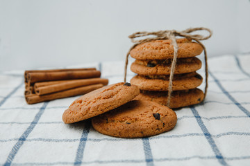 chocolate cookies and cinnamon sticks in the background
