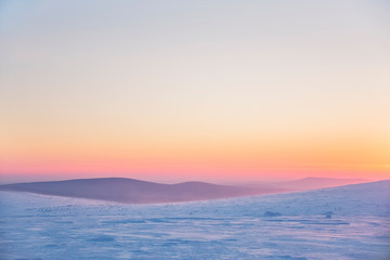 Fototapeta na wymiar Snow desert at sunrise. Northern Ural mountains, Russia