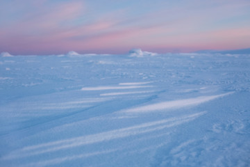 Fototapeta na wymiar Snow desert at sunrise. Northern Ural mountains, Russia