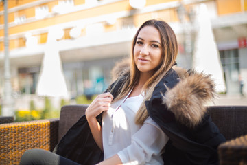 Photographing a girl during autumn with a blurred background