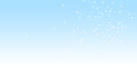 Fototapeta premium Sparse glowing snow Christmas background. Subtle f