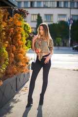 Photographing a girl during autumn with a blurred background