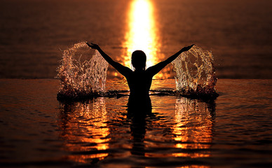 silhouette of man and woman at sunset