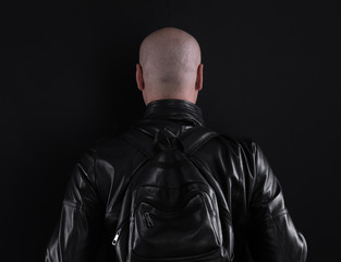 studio portrait of a biker on a black background