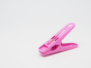 Pink clothespin, white background