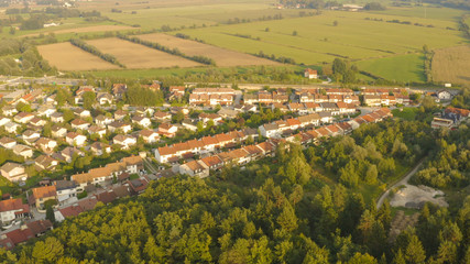AERIAL: Flying high above the elite townhouses surrounded by rural landscape.
