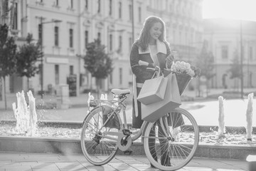 Smiling woman typing text message on smart phone