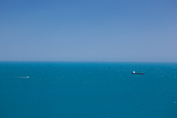 Obraz premium abstract Blue sky and container ship far in the open sea background