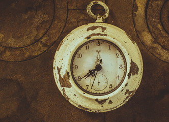 old clock on vintage iron background
