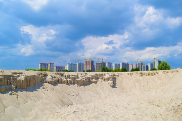 View over the mountain from the sand to the city in the distance.