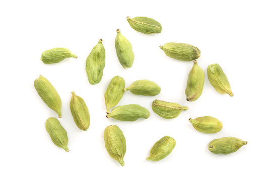 Green cardamom seeds isolated on white background. Top view. Flat lay
